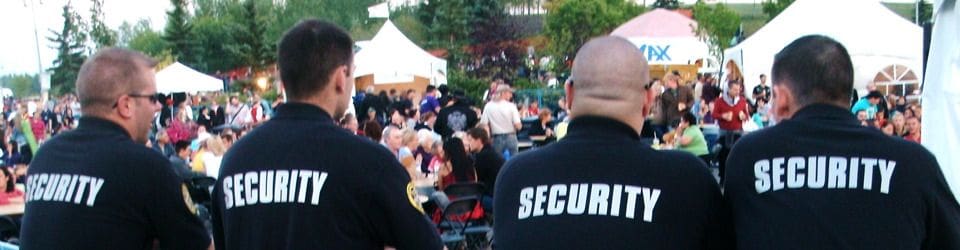 A crowd of people in black and white shirts.